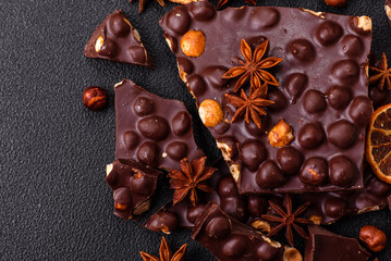 Black bitter chocolate with whole hazelnuts, candied fruits and mint