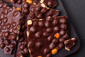 Black bitter chocolate with whole hazelnuts, candied fruits and mint