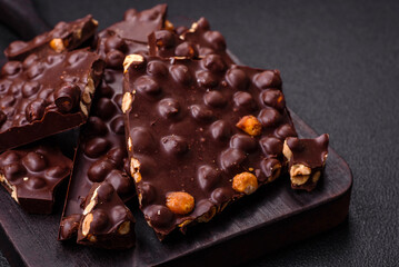 Black bitter chocolate with whole hazelnuts, candied fruits and mint