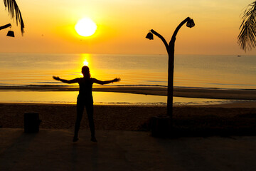 Traveler exercise and sunrise at beach