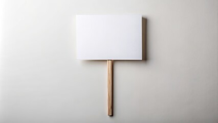 Isolated wooden stick holds empty blank banner mock up, awaiting customization, set against a clean background, signaling openness to creative expression.