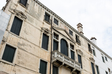 View to typical house in Venice with windows with shutters
