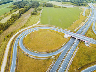 Aerial photo of highway intersection surrounded by farmland