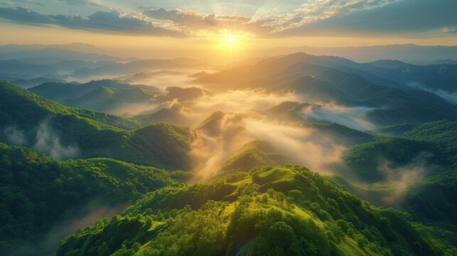 A breathtaking view of a serene mountain landscape at sunrise, with misty valleys, lush greenery, and a clear blue sky.