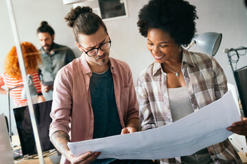 Young business people, engineers, managers working with new startup project in modern office