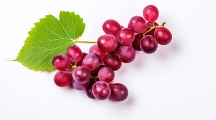 Fototapeta premium Red grapes with green leaves and half sliced on white background. 