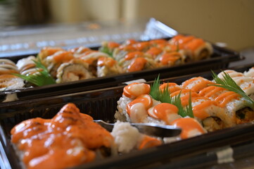 Various of Japanese food close up view. Served asian sushi rolls close up macro shot. Japanese seafood restaurant. Fresh salmon fish with rice. Traditional Japan food.