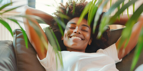 portrait of a African American woman with closed eyes resting lying on the sofa