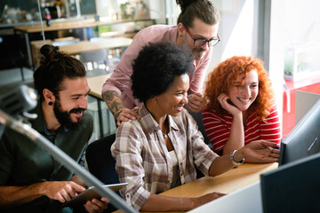 Group of business people and software developers working as a team in office