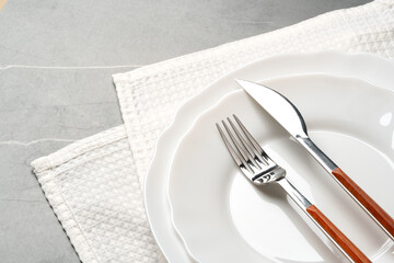 Elegant table setting on grey marble background