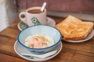 Traditional oriental Chinese kopitiam style in Melaca Malysia eggs bread and coffee
