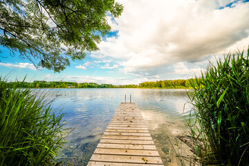 View of the quarry pond near Ingolstadt with the surrounding nature. Landscape by the lake in the recreation area.
