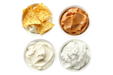 An assortment of Sour Cream Dips displayed in bowls isolated on transparent white background.