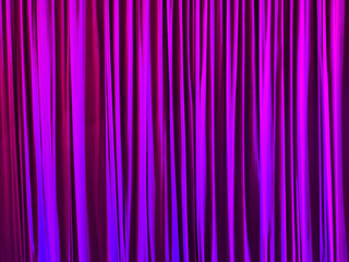 Pink curtain in the theater as an abstract background. Texture