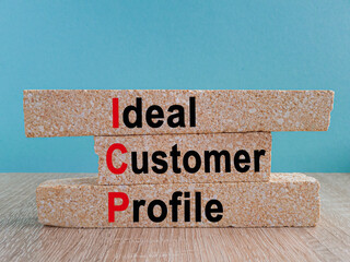 ICP ideal customer profile symbol. Concept words ICP ideal customer profile on brick blocks. Beautiful blue background, wooden table. Business ICP ideal customer profile concept.