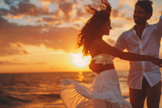 blured man and woman dancing on the beach, sunset sky with orange clouds, the sea in the background, the woman wearing a white dress, holding hands, golden hour light, a romantic atmosphere