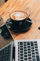 Closeup of coffee cup on table in empty corporate conference room before business meeting in office