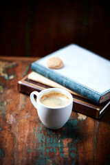 Cup of coffee on wooden background. Close up.