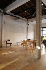 Interior design and decoration at coffee cafe, bakery bar and grocery store decorated with wooden furniture in industrial loft style