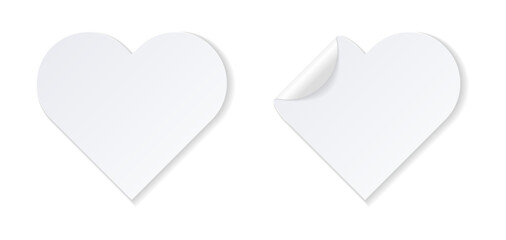 Realistic white heart-shaped stickers with folded corner.