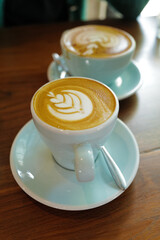 Close up ceramic cup of hot Latte art coffee
