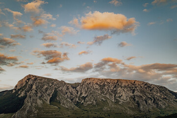 Panoramic Drone view of Limestone Cliffs of Piatra Secuiului in Rimetea Village. Colorful clouds...