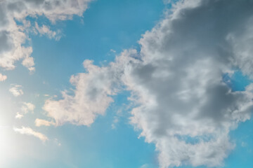 White clouds almost completely covered the blue of the clear sky. Background for art blanks, wallpaper for the computer desktop, screensaver