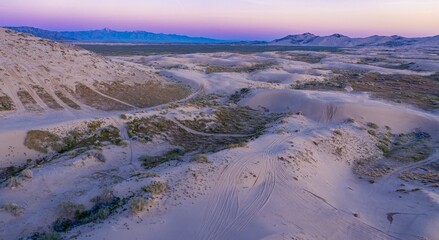 Texture of giant sand dunes and mountain range at sunset at the Little Sahara Recreation Area,...