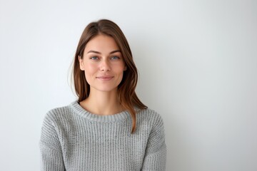 Fototapeta premium Smiling Woman in Gray Sweater with Hands Folded. Generative AI.