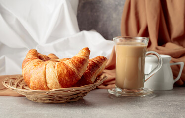 Croissants and coffee with cream.