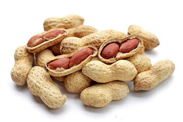 Roasted peanuts in shell on white background.