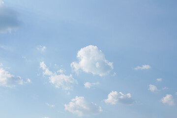 Blue sky and white puffy clouds.