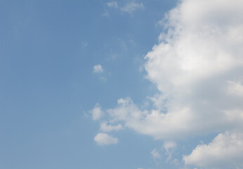 Blue sky and white puffy clouds.