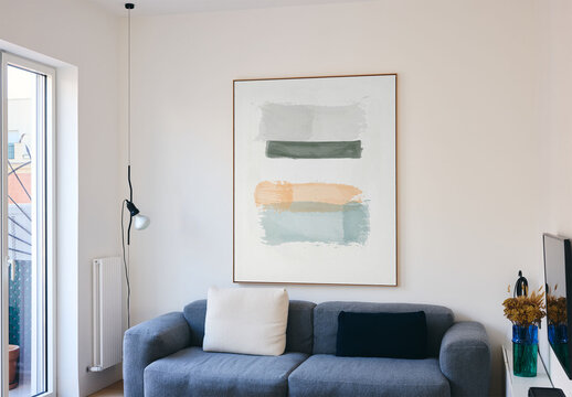 Mockup Of Vertical Customizable Picture Frame On Wall