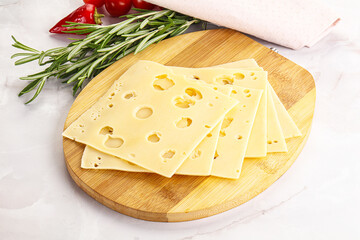Sliced maasdam cheese with holes