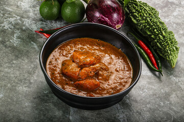Indian cuisine - chicken curry with spices