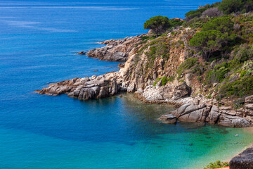 Fototapeta premium Cavoli beach in Tuscany, Elba island. the crystal clear waters of the Elba island seen from the drone