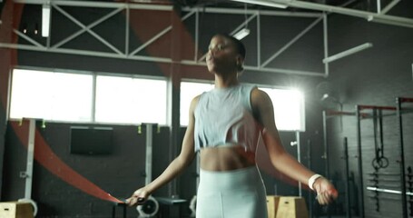 Jump, skipping rope or black woman with fitness for body health, training or cardio exercise challenge. Development, agility or African girl athlete in gym with wellness, mobility workout or energy - Powered by Adobe