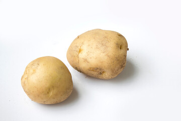 Fototapeta premium White background with brown potato.