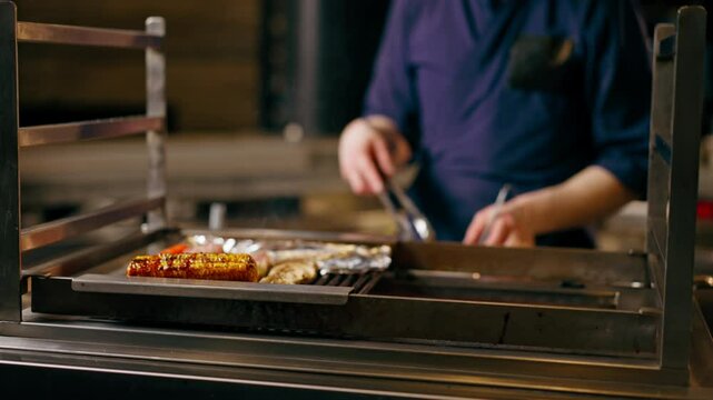 close up in Japanese restaurant the chef grills various vegetables as a side dish for fish