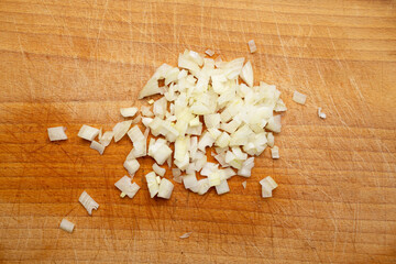 Onion cuts isolated, chopped white onion, vegetable small cubes