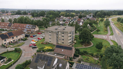 Obraz premium Aerial shot of apartment building flat in a street in a residential area neighborhood in Steenwijk, Overijssel, The Netherlands.