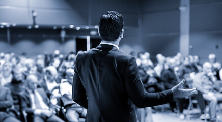 Speaker at Business Conference with Public Presentations. Audience at the conference hall....