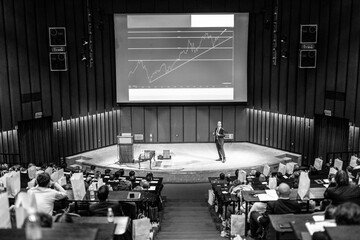 Speaker Giving a Talk at Business Meeting. Audience in the conference hall. Business and Entrepreneurship concept.