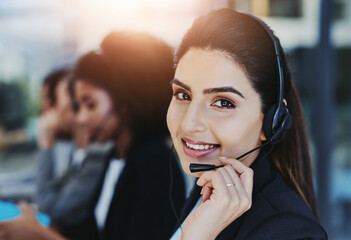 Woman, portrait and smile in call center with headset for customer service, crm and help or...