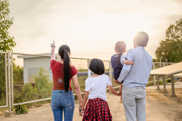 A modern father shows the potential of alternative energy to his family.