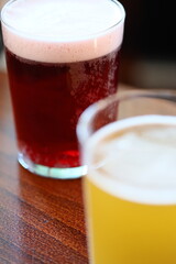 A close-up of a glass filled with a clear liquid, sitting on a table.