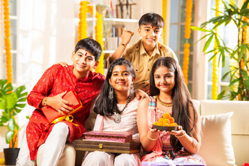 Indian brother and sister enjoying togetherness while celebrating rakhi, rakshabandhan or bhai dooj