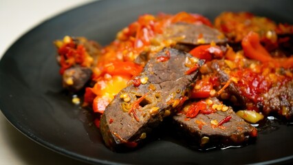 Lung beef (paru balado) cooked in spicy balado seasoning, which is sure to arouse appetite, selective focus and close up