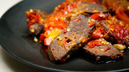 Lung beef (paru balado) cooked in spicy balado seasoning, which is sure to arouse appetite, selective focus and close up